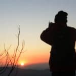 Silhouette of a person against a sunset